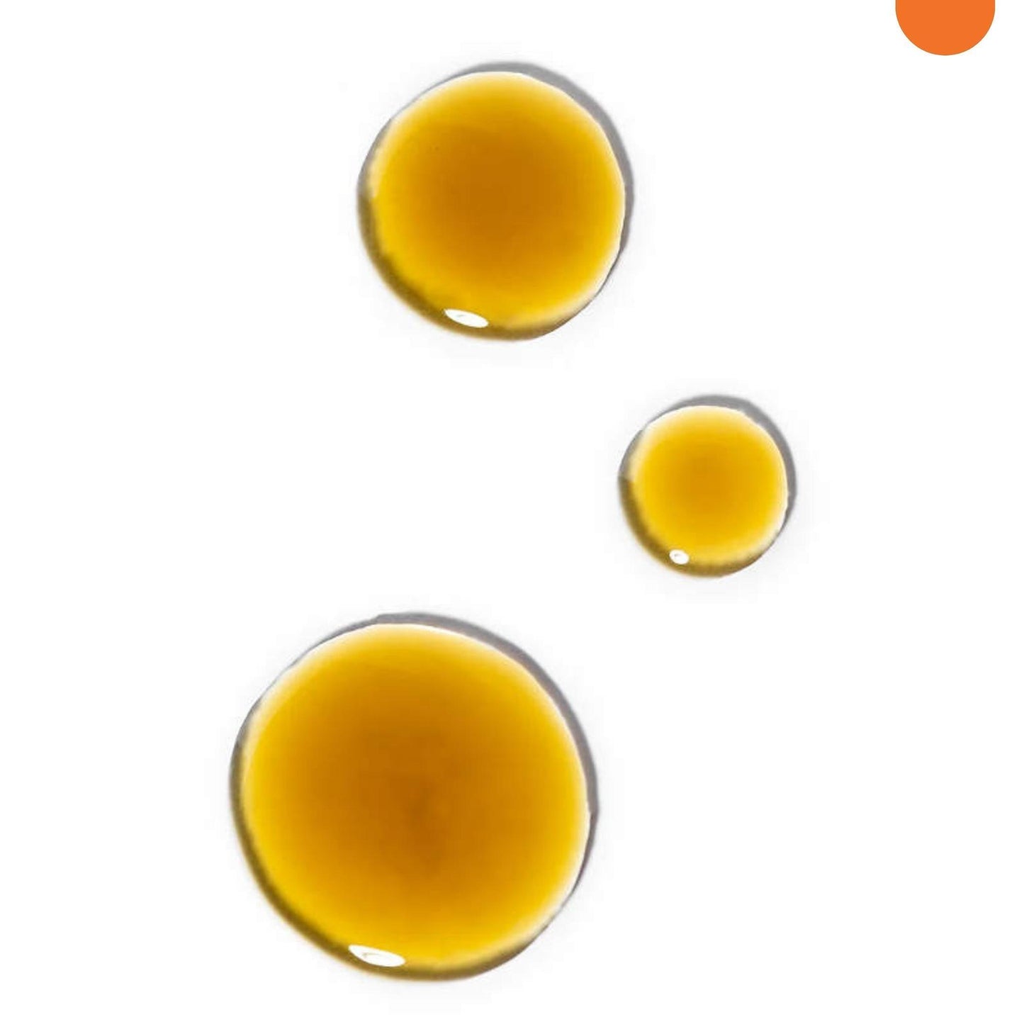 Three circular drops of golden-brown liquid on a white background, arranged in a triangular pattern. The largest drop is at the top center, with two smaller drops below it to the right. An orange circle, hinting at Modest Beauty Antioxidant Q10 Serum and age-defying serum properties, is near the top right corner of the image.