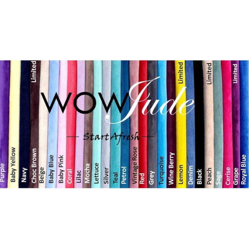 A collection of colorful WOW Jude Face Cleansing Cloths arranged vertically. Each cloth, perfect for makeup removal and suitable for acne-prone skin, has its color name written on it, including Baby Yellow, Navy, Charcoal, Dove, Orange Brown, Silver, Teal. The brand name "WOW Jude" and the slogan "Start Afresh" are centered.